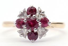 Diamond and ruby cluster ring featuring 4 round graduated rubies interspersed with 4 trillion cut