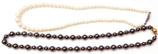 Mixed Lot: cased Osaki simulated pearls together with a haematite and gilt bead necklace (2)