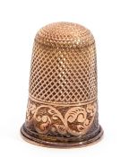 10ct stamped thimble, with pitted crown and chased engraved body, 3.8gms