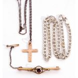 Mixed Lot: 9ct stamped cross, chase detail on a metal chain; a 9ct stamped brooch centring a