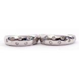 Pair of 18ct stamped half hoop earrings, each flush set with 8 round brilliant diamonds to post