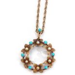 Early 20th century 15ct stamped turquoise and seed pearl open work pendant, a design of a garland of