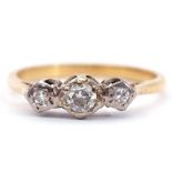 Precious metal three stone diamond ring featuring 3 graduated diamonds, each in an illusion setting,