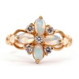 18ct gold opal and diamond cluster ring, featuring 4 oval cabochon opals highlighted with 5 small