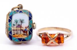 Mixed Lot: 9ct gold and amber ring, together with a silver gilt and enamelled locket pendant, the