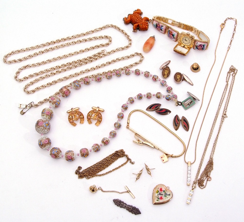 Case of gold plated necklaces, lockets, cuff links, bead necklace