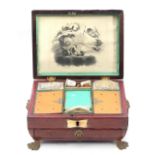 Regency brass mounted red leather sewing box, the fitted interior with two porcelain thimbles, one