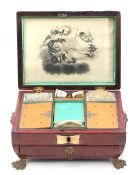 Regency brass mounted red leather sewing box, the fitted interior with two porcelain thimbles, one