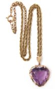 Large amethyst heart shaped pendant, 23mm x 23mm, multi-claw set in a yellow metal scroll and bead
