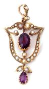 9ct stamped amethyst and seed pearl pendant of open work design centring an oval faceted amethyst
