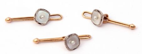 Three mother of pearl and seed pearl dress studs/buttons suspended on 14K stamped bars, each