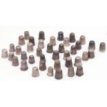 Collection of 40 white metal and silver thimbles, various sizes, some a/f