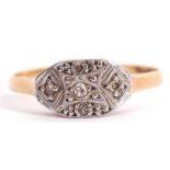 Precious metal diamond cluster ring, the shaped oval plaque set with five small single cut diamonds,