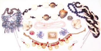 Large quantity of costume jewellery to include necklaces, brooches etc