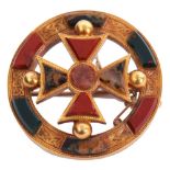 Victorian Scottish agate brooch of circular form, centring a cross with engraved Celtic motifs and