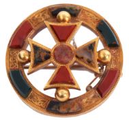 Victorian Scottish agate brooch of circular form, centring a cross with engraved Celtic motifs and