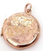 Edward VII 9ct gold circular locket with chased and engraved front and back with a foliate design,