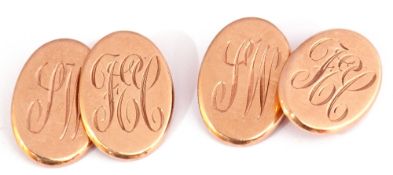 Pair of 9ct gold cuff links of oval shaped form, each panel engraved with a monogram and with