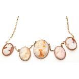Antique cameo necklace featuring 5 various graduated oval cameos, each depicting a classical lady in