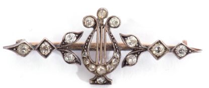 Antique lyre diamond set brooch, design featuring a central lyre on a knife edged bar, decorated