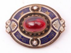 Victorian oval brooch, the centre with an oval cabochon red stone within a blue and white enamel and