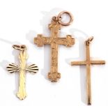 Mixed Lot: two hallmarked 9ct gold crosses together with a 9ct stamped and engraved and chased