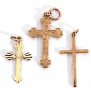 Mixed Lot: two hallmarked 9ct gold crosses together with a 9ct stamped and engraved and chased