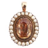 Antique citrine and seed pearl pendant, the oval faceted citrine surrounded by 23 small seed