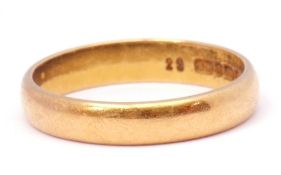 A 22ct gold wedding ring of plain polished design, Birmingham 1955, 3.4gms, size L/M
