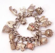 White metal curb link bracelet suspending various white metal charms, 154.3gms