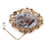 Antique mourning brooch, the oval glazed panel having painted floral design applied with a lock of