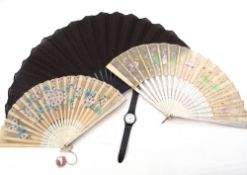 Mixed Lot: two vintage hand decorated fans, both with card spines, a black linen-fold fan (a/f)