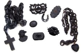 Mixed Lot: two antique jet chains with heart and cross pendant attachment, a carved jet plaque