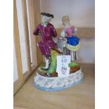 STAFFORDSHIRE STYLE FIGURE OF A COURTING COUPLE