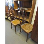 PAIR OF OVAL BACK HALL OR BEDROOM CHAIRS WITH CARVED RIBBON DETAIL AND CANE SEATS, HEIGHT 95CM