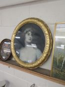 OVAL FRAMED PRINT OF A GIRL AFTER ROMNEY IN HEAVY GILT DECORATIVE FRAME, TOTAL SIZE 70CM