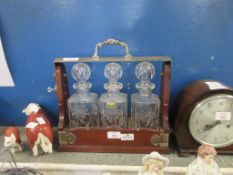 TANTALUS CONTAINING THREE MATCHING LEAD CRYSTAL DECANTERS
