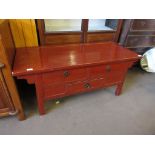 MODERN CHINESE STYLE HARDWOOD TABLE WITH THREE DRAWERS, PAINTED IN RED, 122CM WIDE