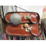 TWO CASED PETANQUE SETS WITHIN LEATHER CASES