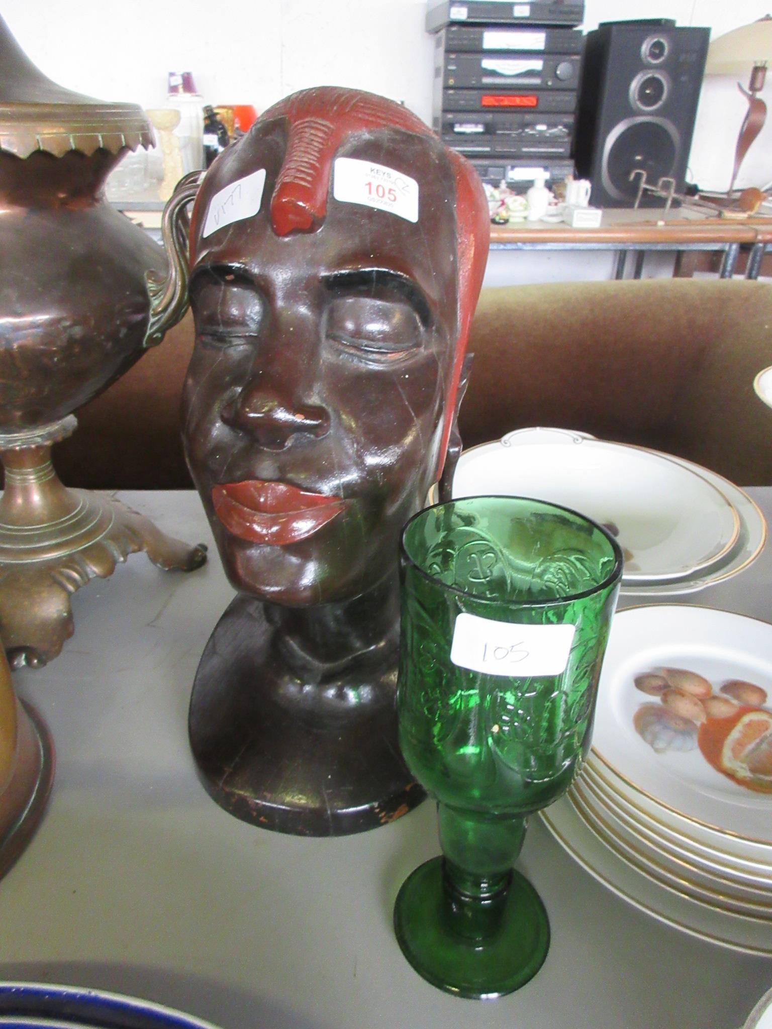 HEAVY DARK WOOD TRIBAL SCULPTURE OF A WARRIOR’S HEAD TOGETHER WITH A MOULDED GLASS GROLSCH GOBLET