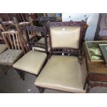 LEATHER UPHOLSTERED HALL CHAIR, HEAVILY CARVED TOGETHER WITH TWO SIMILAR SMALLER EXAMPLES, LARGEST