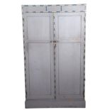 A mid century wardrobe painted in light grey with floral border, probably by Heals, 182cm high