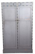 A mid century wardrobe painted in light grey with floral border, probably by Heals, 182cm high