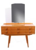 Mid-20th century Heals dressing table with six drawers and mirrored back supported by splayed