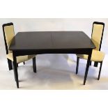 Retro style black painted extending dining table and chairs, the table with two leaves and six tall