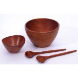 Mid-20th century Danish teak serving bowl together with a smaller example and serving tongs, largest