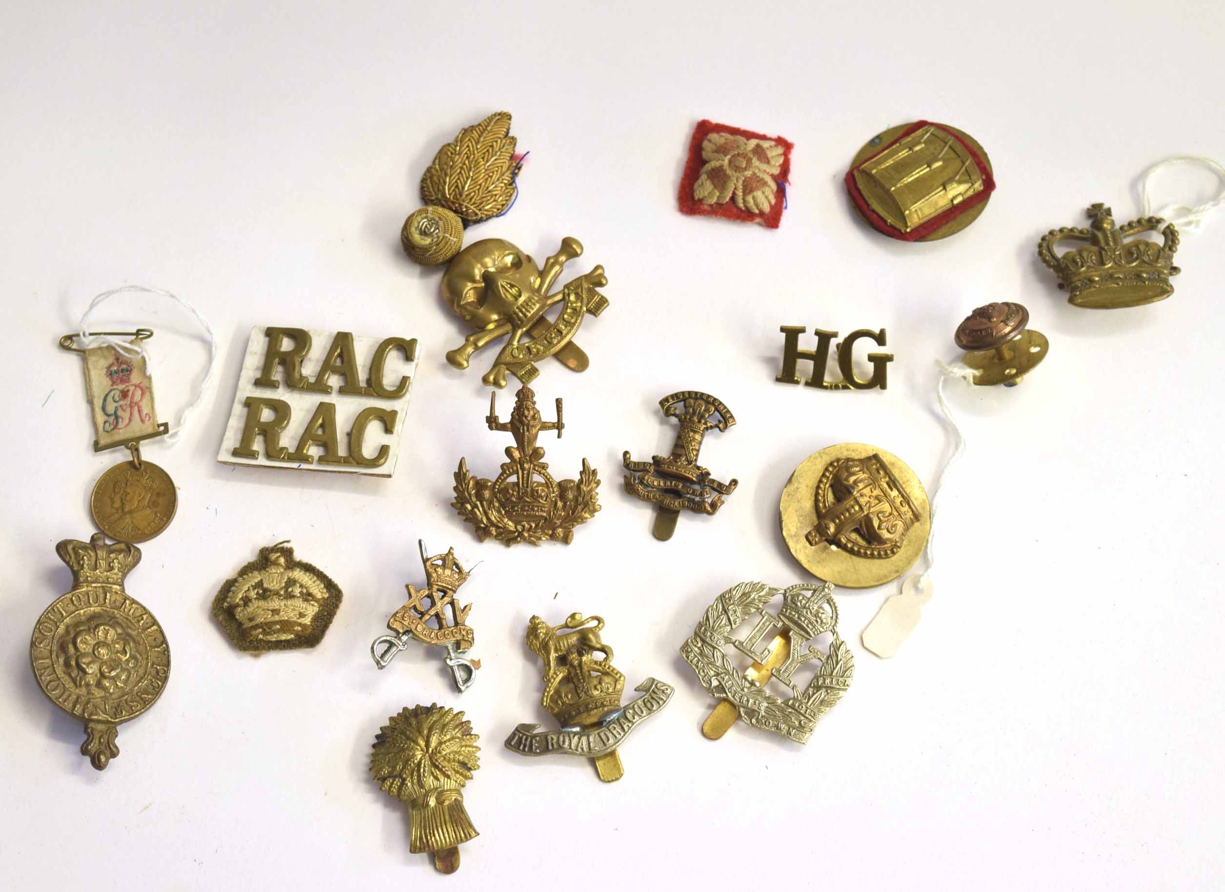 Small quantity of cap badges to include Leicestershire and Derbyshire Yeomanry cap badge, pair of