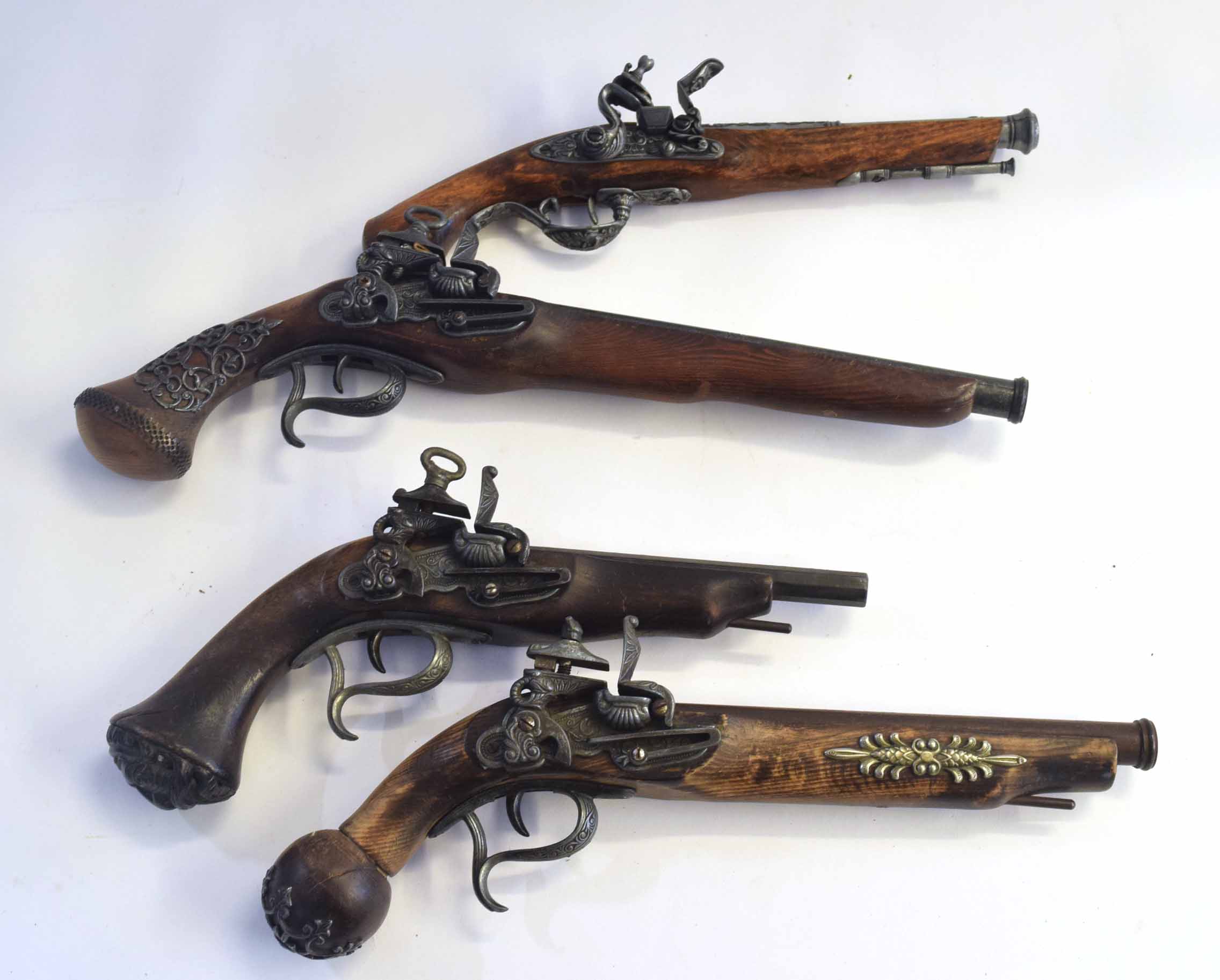 Four replica prop flintlock pistols