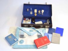 Masonic briefcase containing jewels, apron and handbooks, instructions and manuals