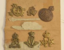 Small quantity of 19th and 20th century military cap badges to include 1908 Hussars brass cap badge,